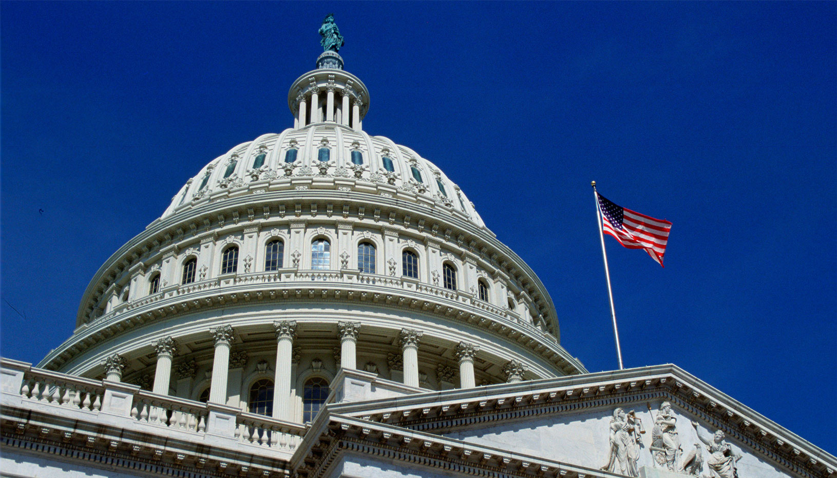 image of the outside of the U.S. Capitol dome, looking up from the ground