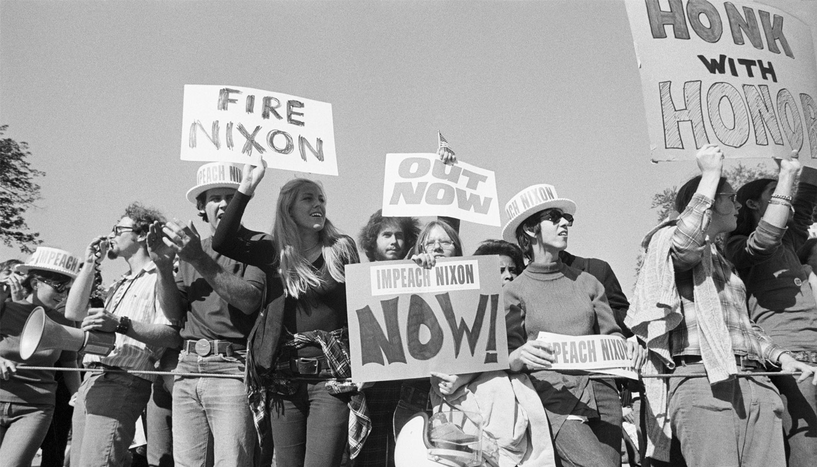 Protesters holding anti-Nixon signs in 1974