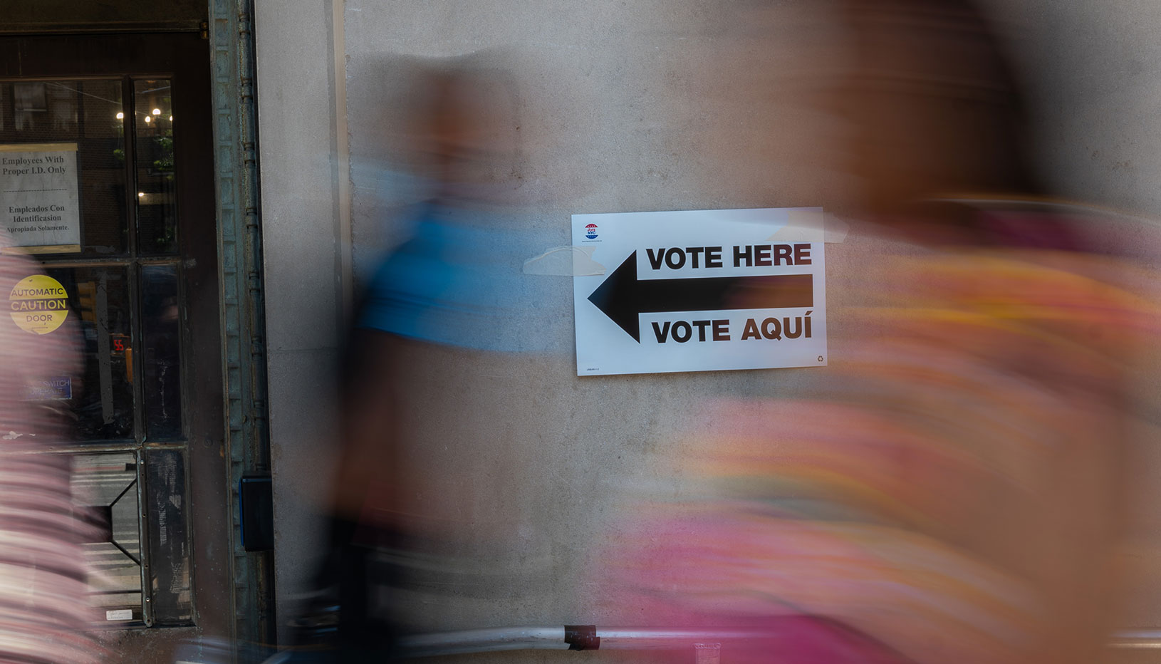 Vote Here Vote Acqí sign