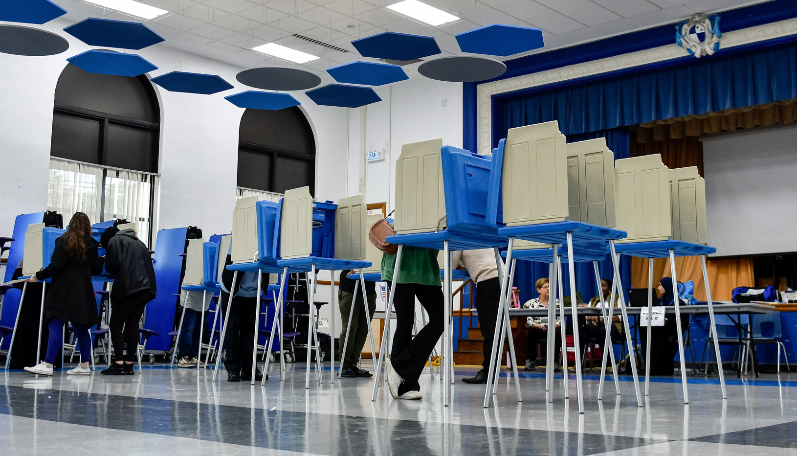 People at voting booths