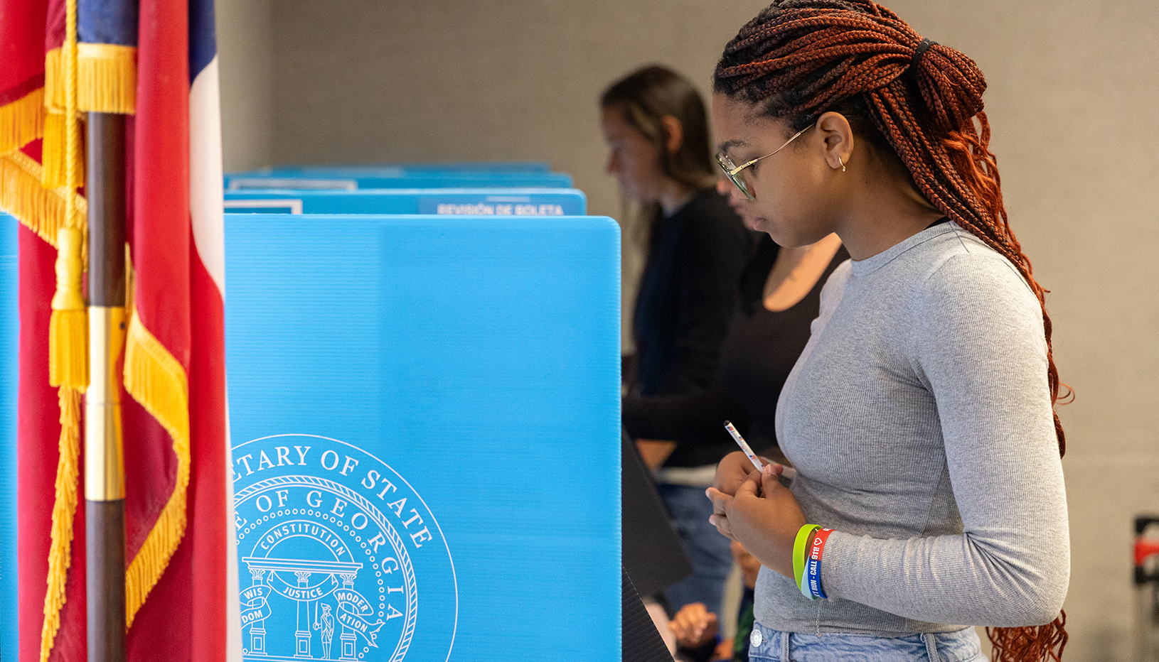 Georgia voter at voting booth.