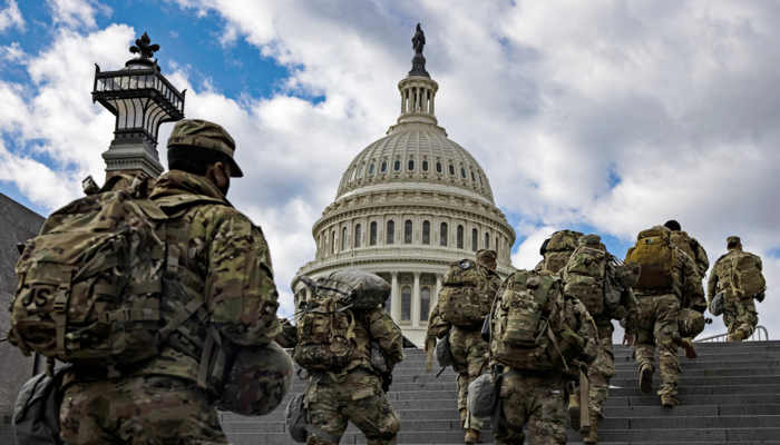 Troops go up the stairs to the U.S. Capitol