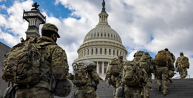 Troops go up the stairs to the U.S. Capitol
