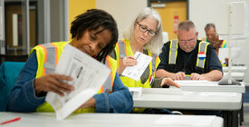 Election workers review ballots