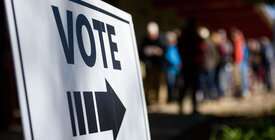 Voting sign and voters