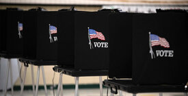 Black voting booths with American flags