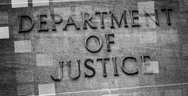 Department of Justice gray sign