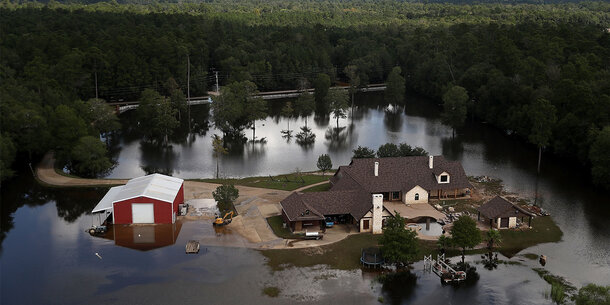 home in Texas surrounded by floodwaters