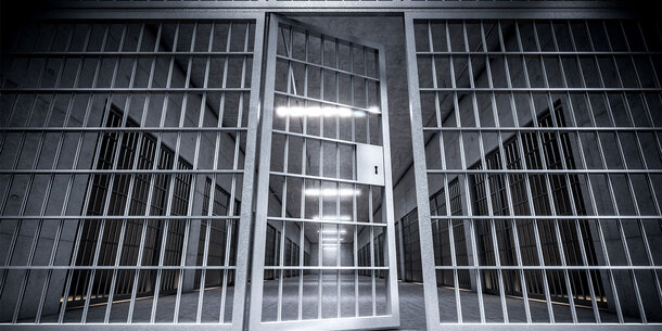 Black and White image of door to jail cells