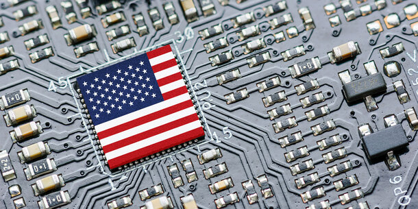 American flag microchip surrounded by a circuit-board
