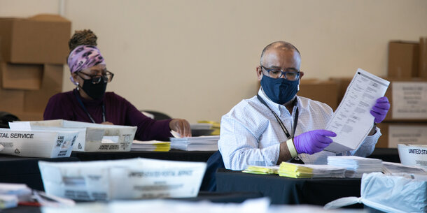 image of Georgia election officials counting ballots