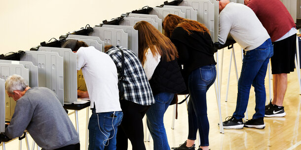 Voters in voting booths